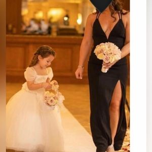 Black gown high slit low plunge neck open back